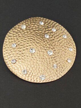 Oversize textured gold pendant with inlaid cz accents